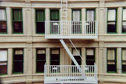 Building with fire escape and venetian blinds